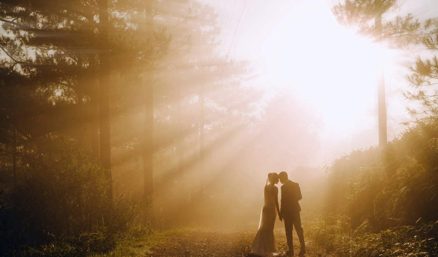 Couple standing in a ray of light