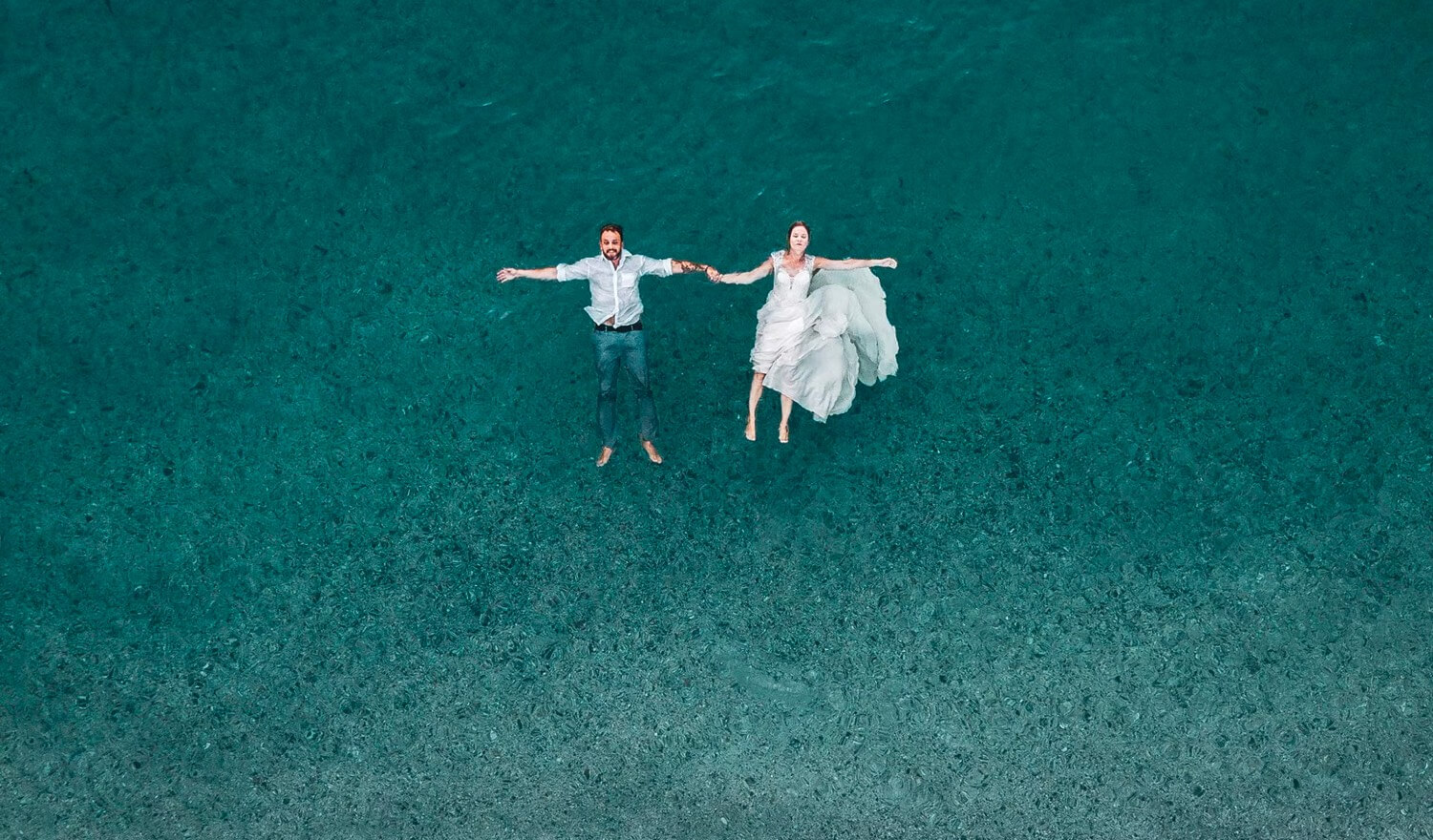 Couple floating in the ocean
