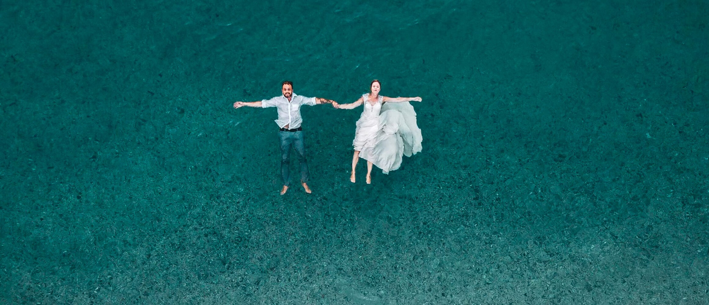 Couple floating in the ocean