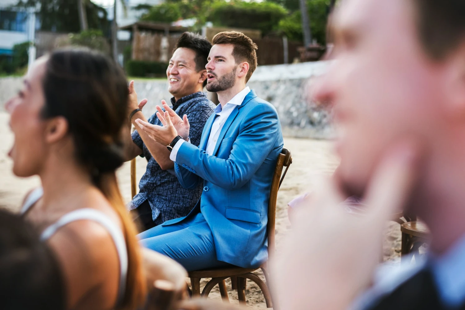 Wedding guests at a private ceremony on the beach