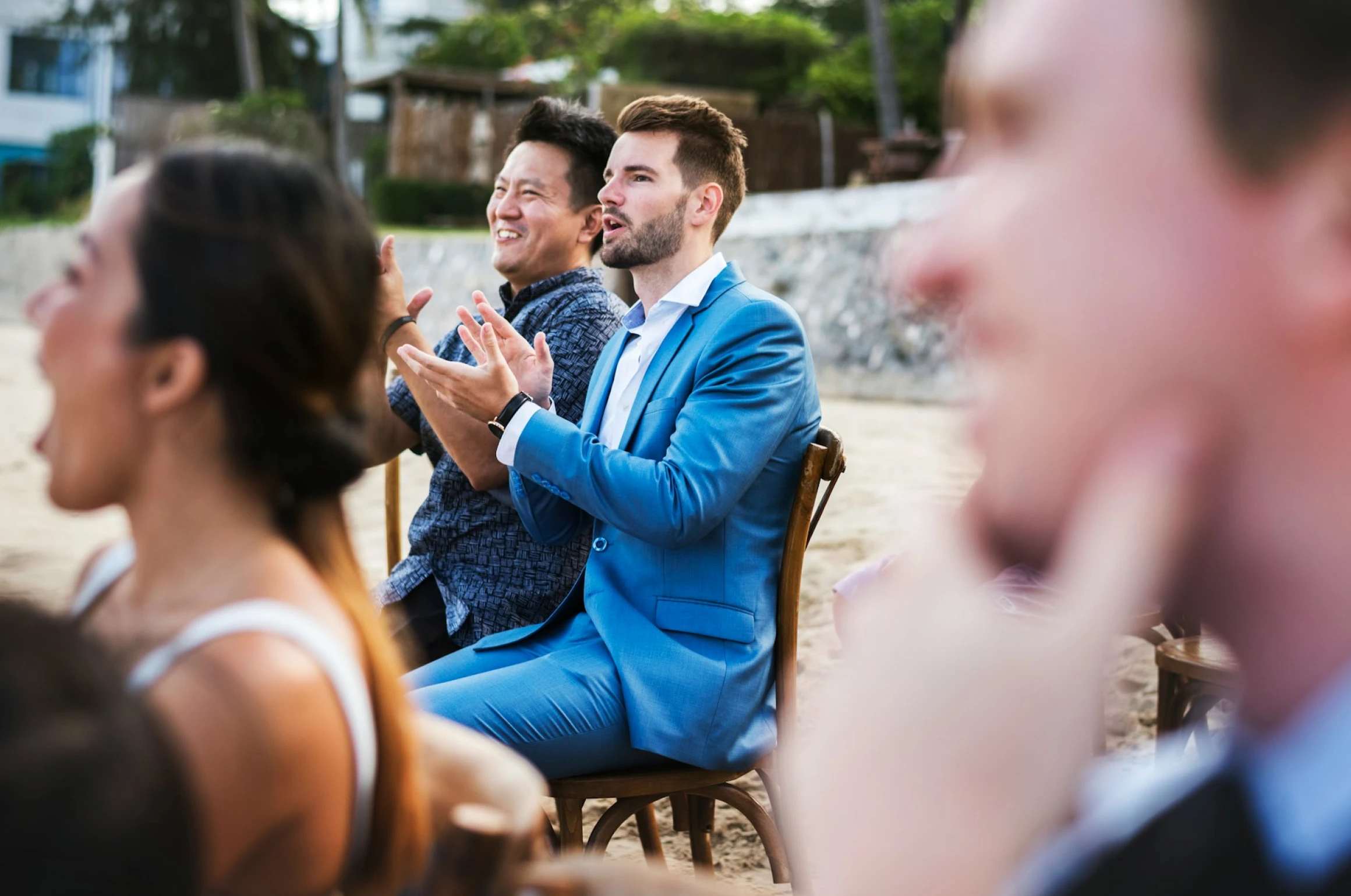 Wedding guests at a private ceremony on the beach